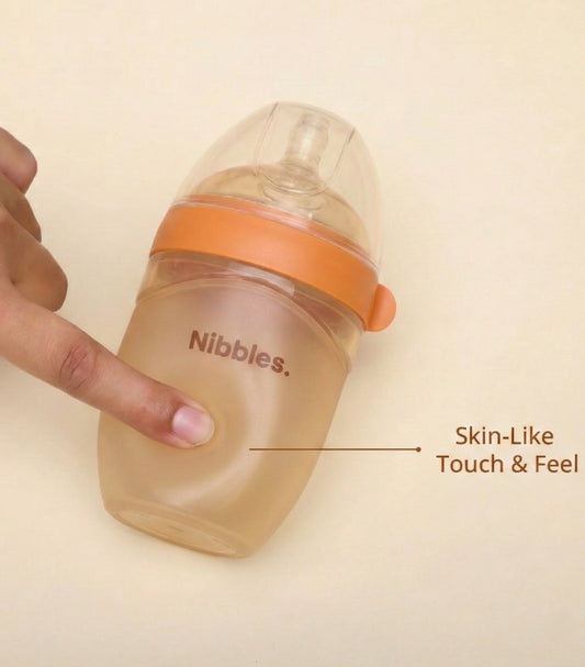 Multi Purpose Silicone Feeding Bottle with Handle & Extra Nipple (Fast Flow) – 210 ml