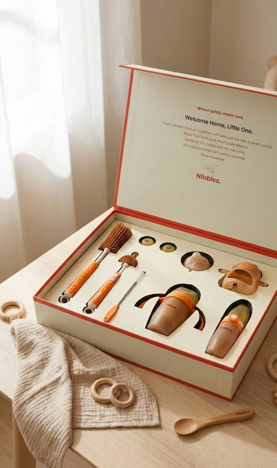 Nibbles baby product set in a box on a wooden surface with a soft light background